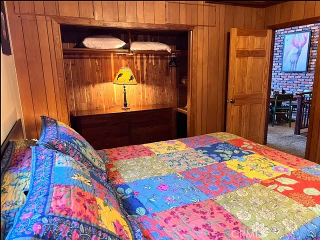 a balcony with furniture and a potted plant