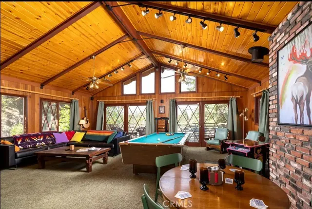 a view of a patio with a table and chairs