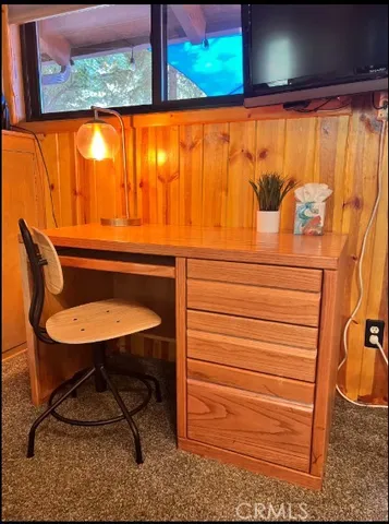 a view of a patio with couches chairs and a potted plant