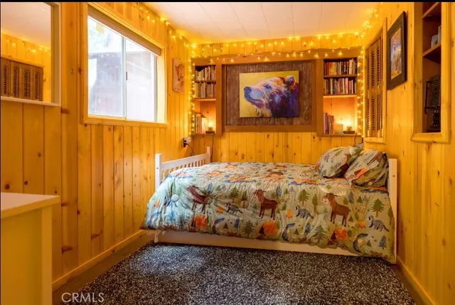 a room with a stove and a wooden floor