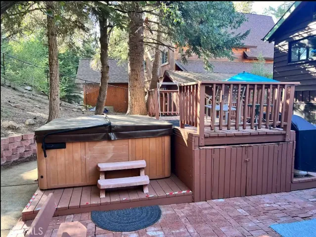 a outdoor living space with patio furniture and a umbrella