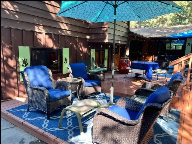 a view of a chairs and table in the terrace
