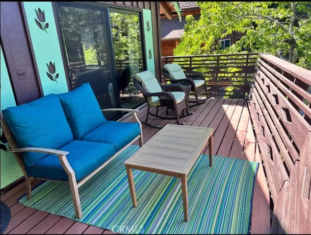 a outdoor living space with patio furniture and a fireplace