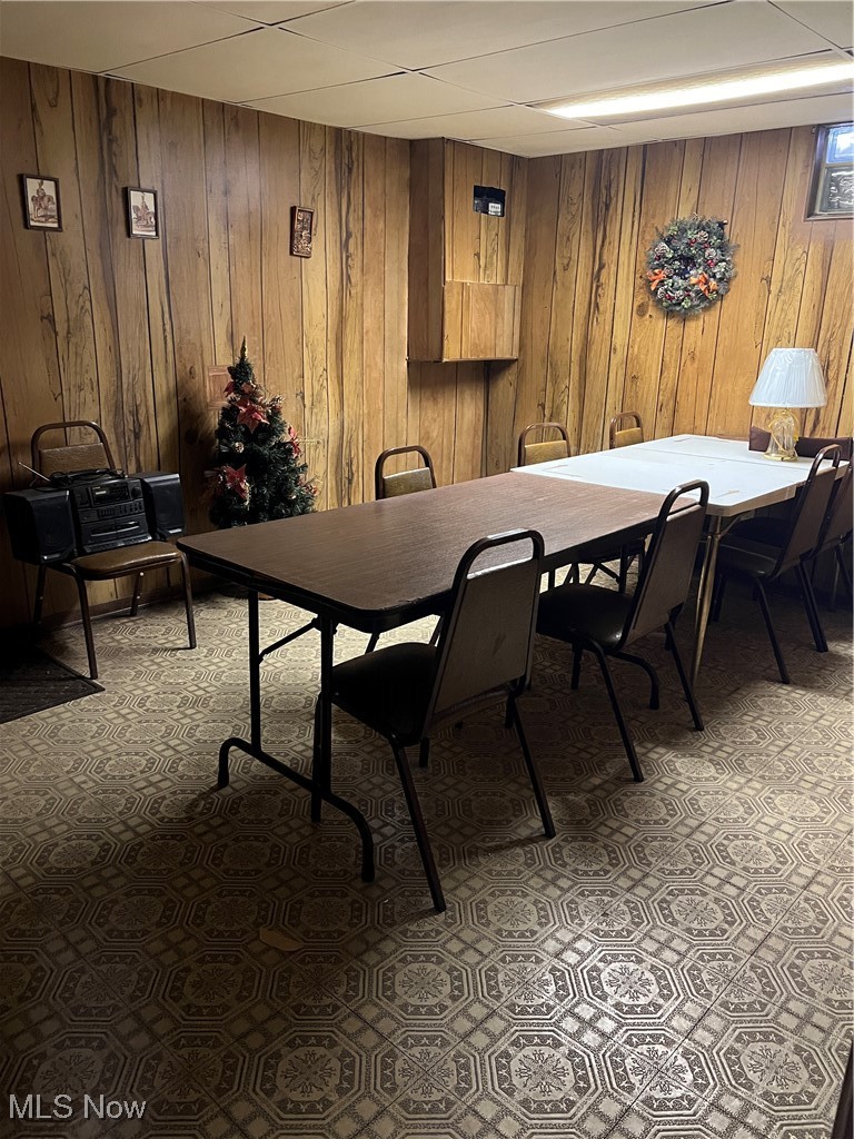 21600 Franklin Road Maple Heights, OH 44137 - Photo 12 of 14 Dining room featuring wooden walls and light colored carpet