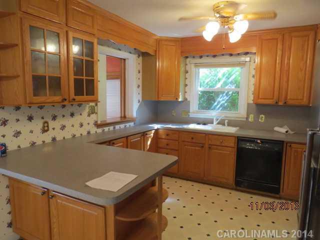 801 Riverwood Road Charlotte, NC 28270 - Photo 7 of 14 a kitchen with granite countertop a sink a stove and dishwasher