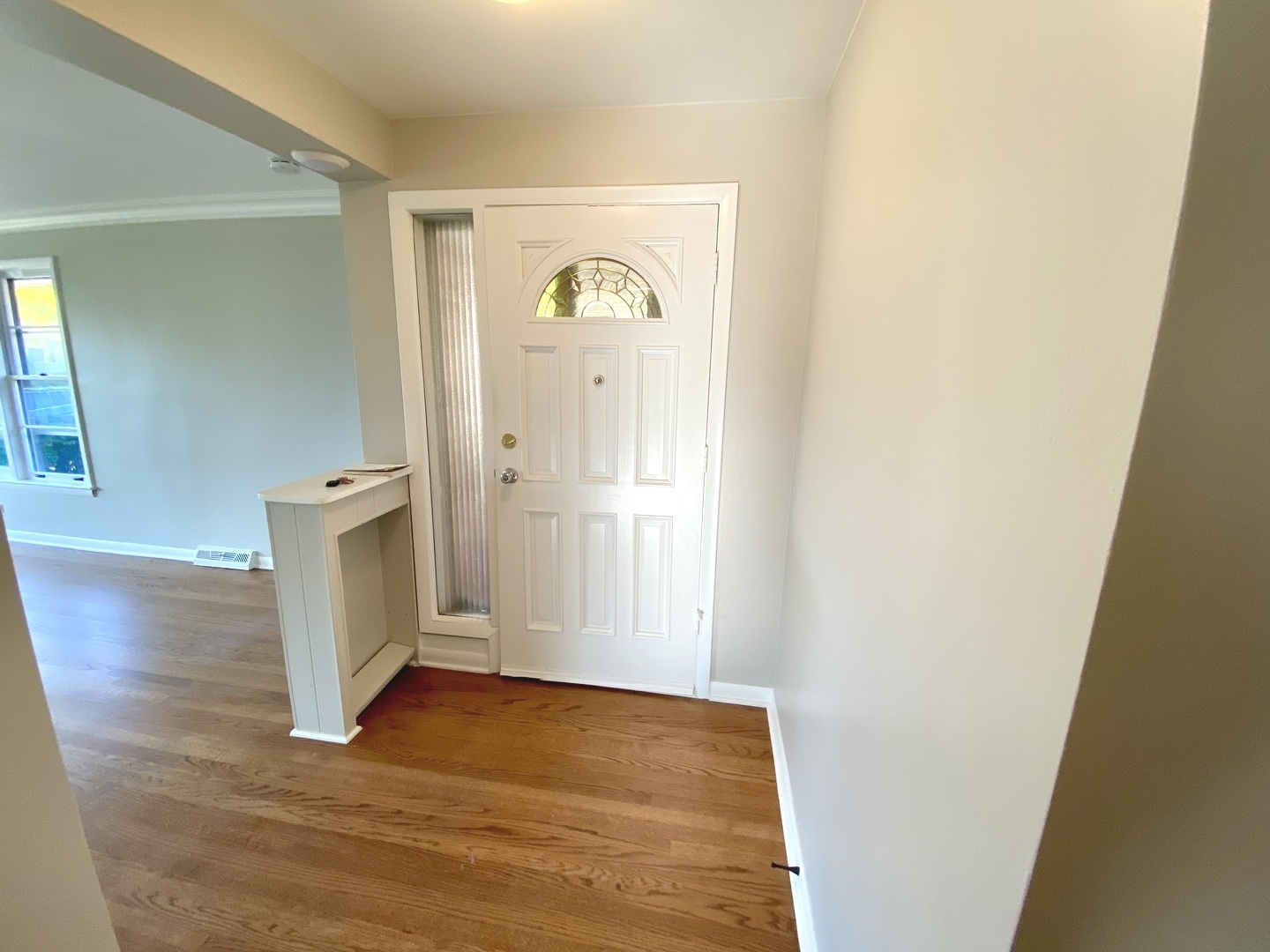 3515 173rd Place Lansing, IL 60438 - Photo 15 of 26 an empty room with wooden floor and mirror