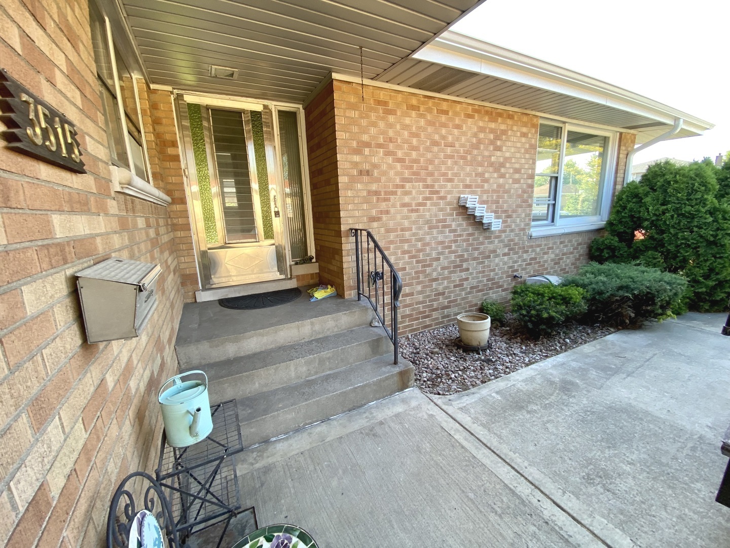 3515 173rd Place Lansing, IL 60438 - Photo 5 of 26 a view of a porch with furniture and garden