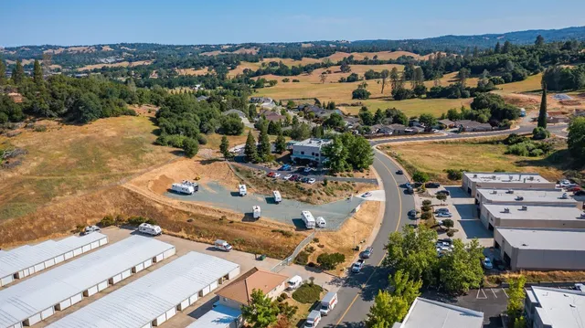 an aerial view of residential houses with outdoor space