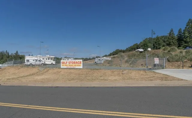 a view of a street with a building in the background