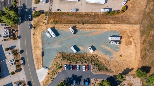 an aerial view of a house with outdoor space