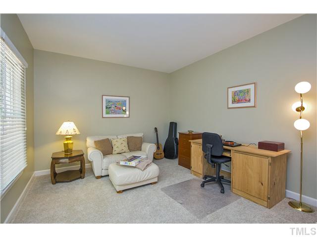 8909 Breeland Way Raleigh, NC 27613 - Photo 11 of 25 a living room with furniture and a window