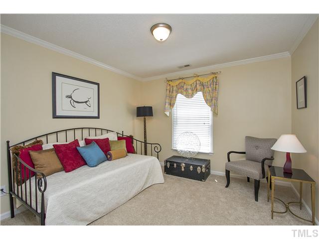 8909 Breeland Way Raleigh, NC 27613 - Photo 16 of 25 a living room with furniture and a large window