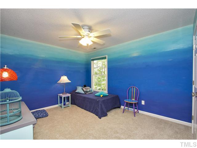 8909 Breeland Way Raleigh, NC 27613 - Photo 18 of 25 a living room with furniture and a window