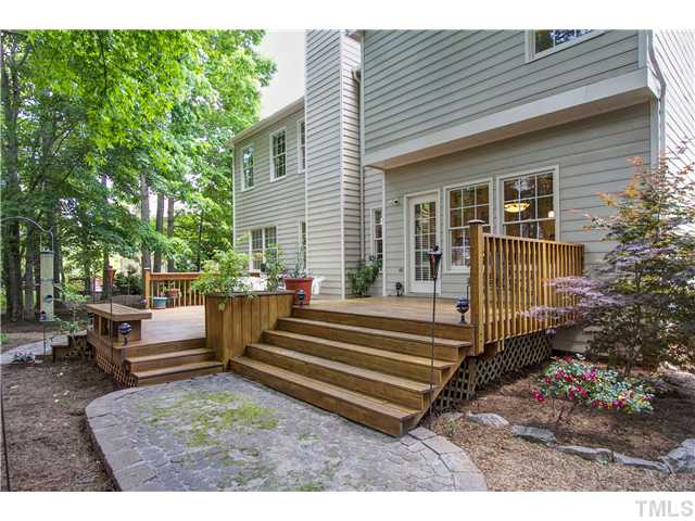8909 Breeland Way Raleigh, NC 27613 - Photo 25 of 25 a view of a house with a backyard and sitting area