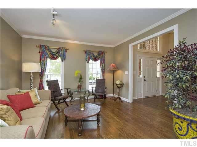 8909 Breeland Way Raleigh, NC 27613 - Photo 3 of 25 a living room with furniture and a large window