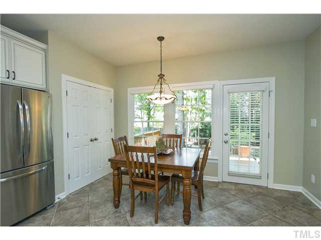 8909 Breeland Way Raleigh, NC 27613 - Photo 10 of 25 a dining room with furniture window and outside view
