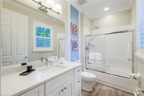 a bedroom with a bed and a table