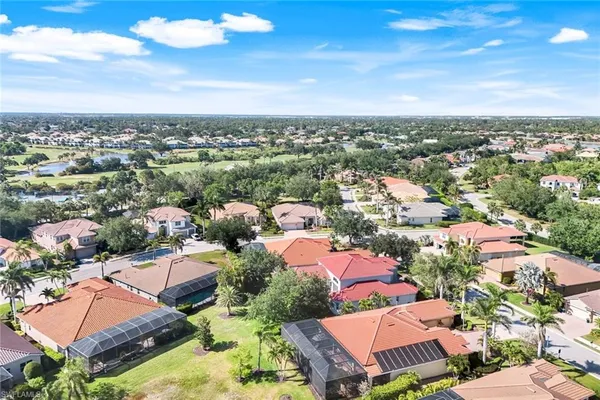 a view of a lake with houses in the background