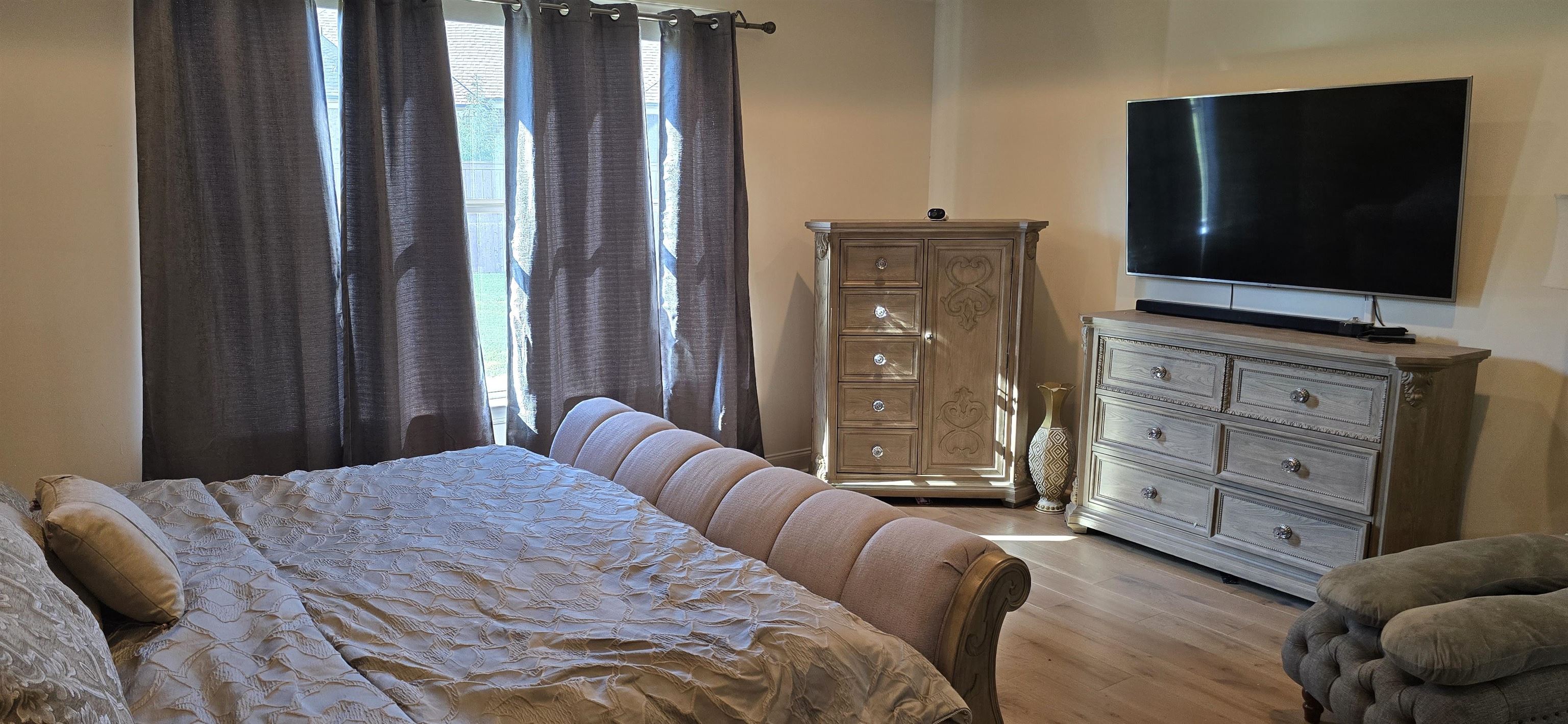 712 East Cypress View Circle Collierville, TN 38017 - Photo 29 of 40 a bedroom with a bed and flat screen tv