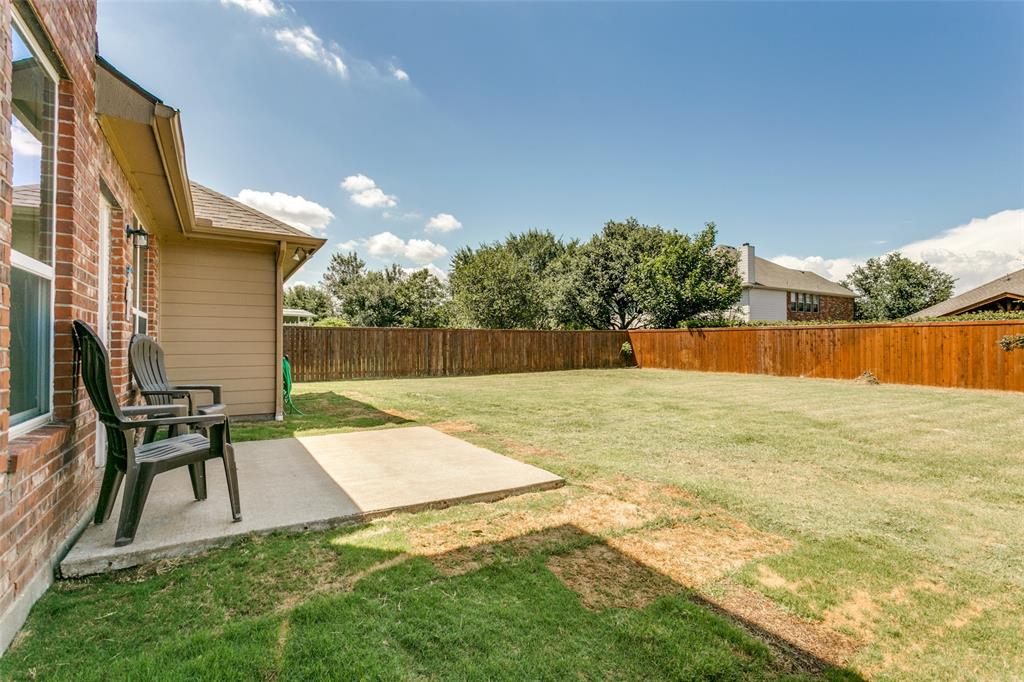 4107 Waverly Road Corinth, TX 76208 - Photo 24 of 30 The oversized, level backyard is fully fenced, and includes a patio for grilling and chilling.