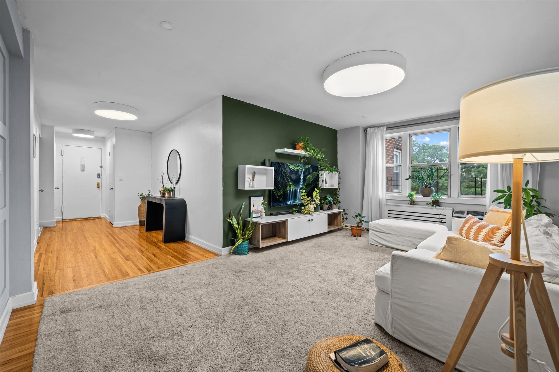 3520 Tryon Avenue, Unit 603 Bronx, NY 10467 - Photo 1 of 15 a living room with furniture and a large window