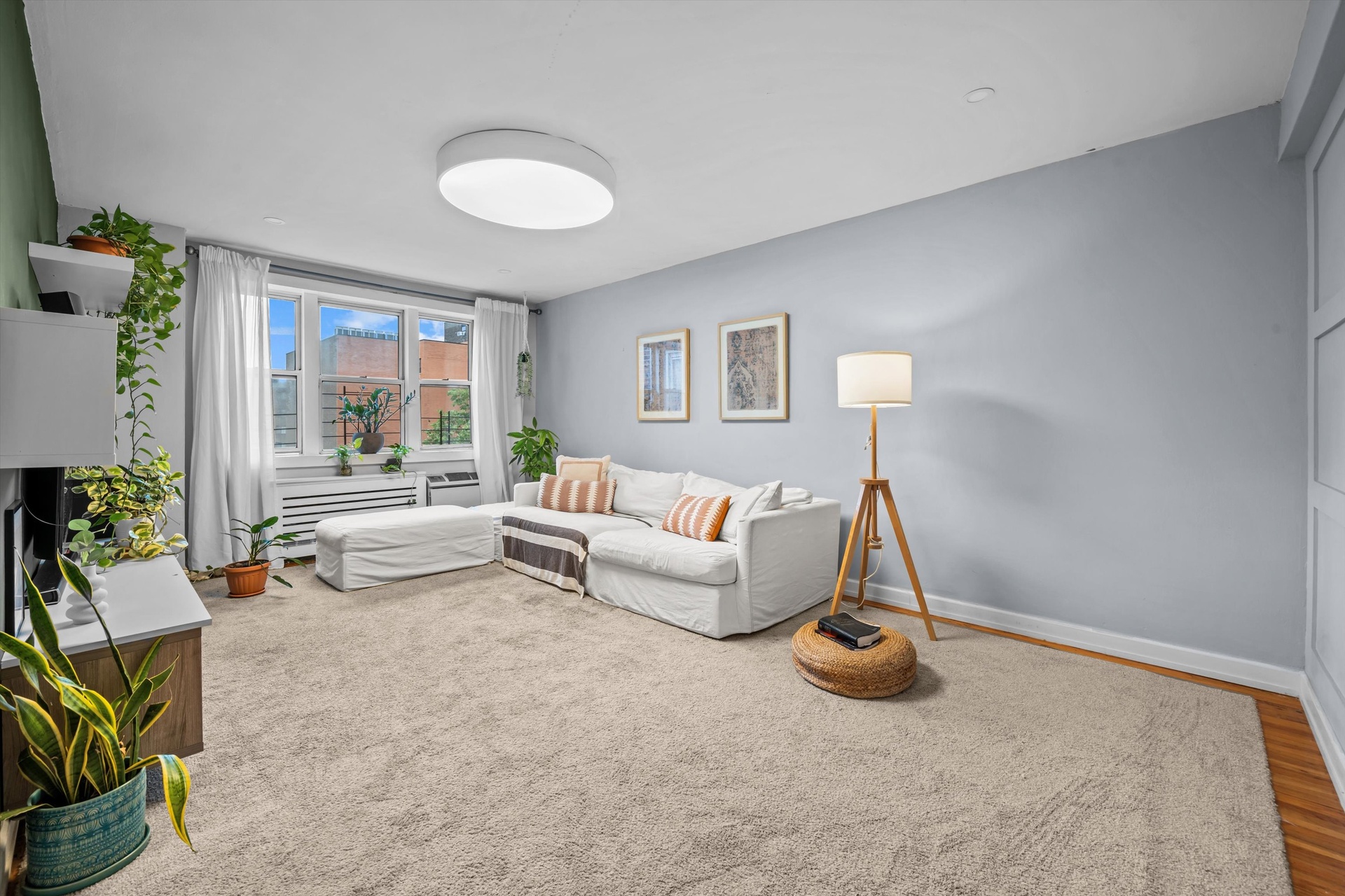 3520 Tryon Avenue, Unit 603 Bronx, NY 10467 - Photo 3 of 15 a living room with furniture and a large window