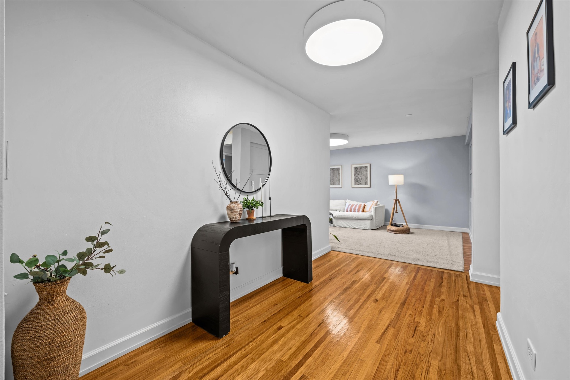 3520 Tryon Avenue, Unit 603 Bronx, NY 10467 - Photo 4 of 15 a living room with furniture and a mirror