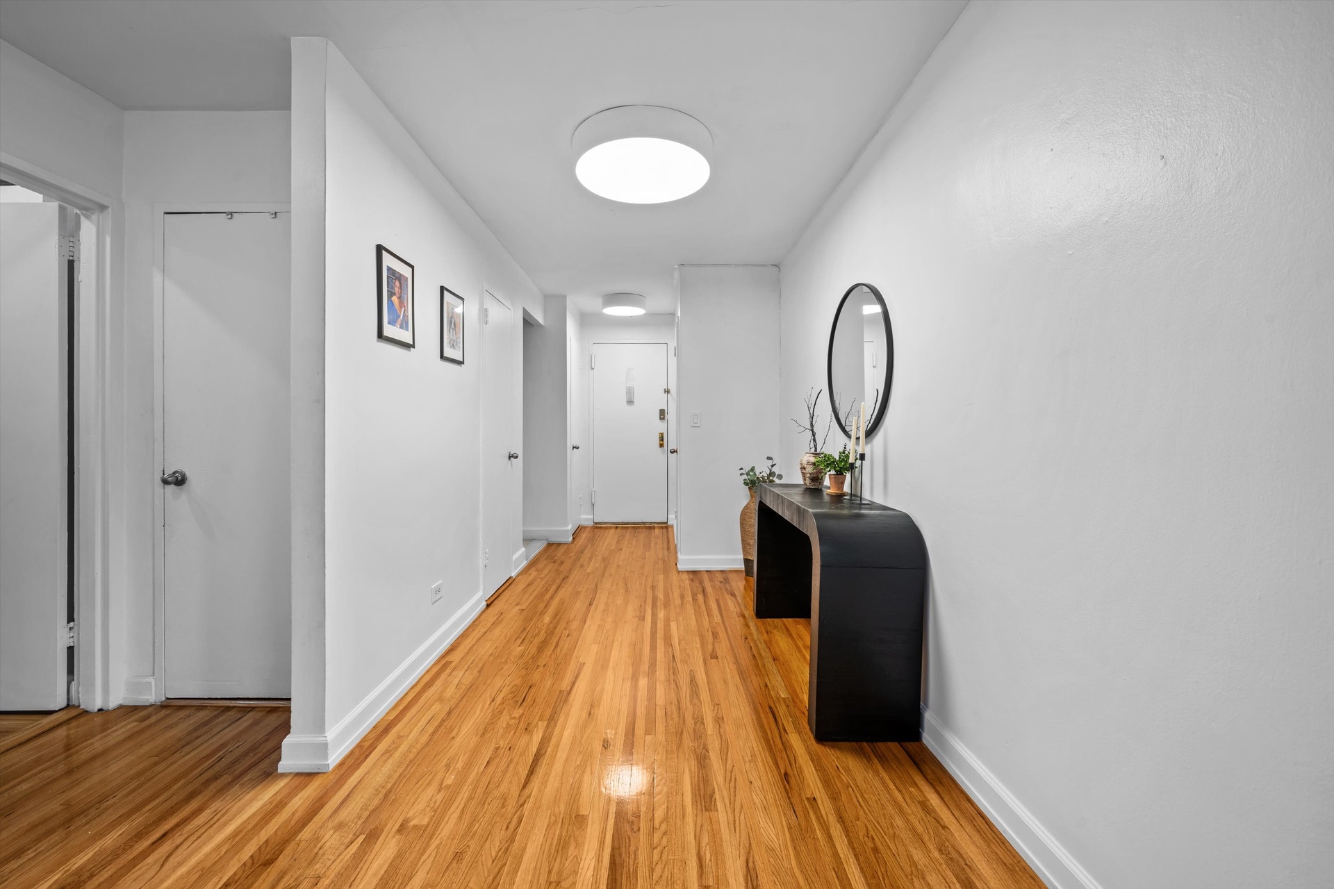 3520 Tryon Avenue, Unit 603 Bronx, NY 10467 - Photo 5 of 15 a bedroom with a bed and wooden floor
