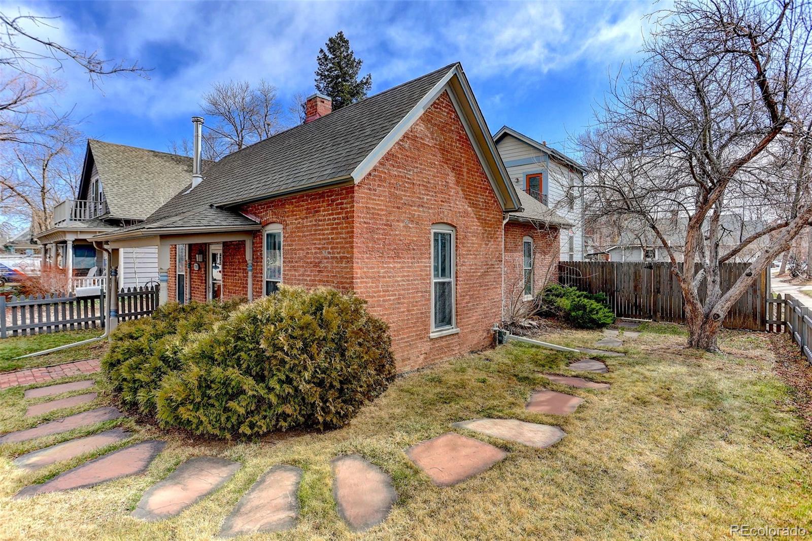 1902 Grove Street Boulder, CO 80302 - Photo 4 of 38 a view of a house with a yard