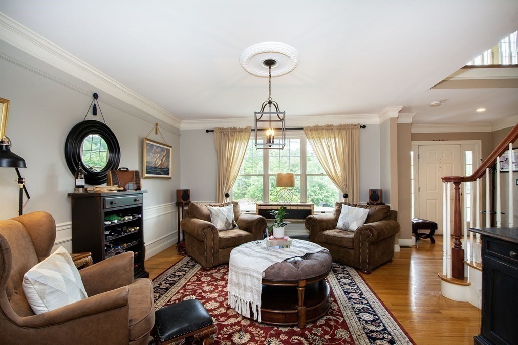 124 Hillcrest Road Marshfield, MA 02050 - Photo 12 of 41 a living room with fireplace furniture and a large window