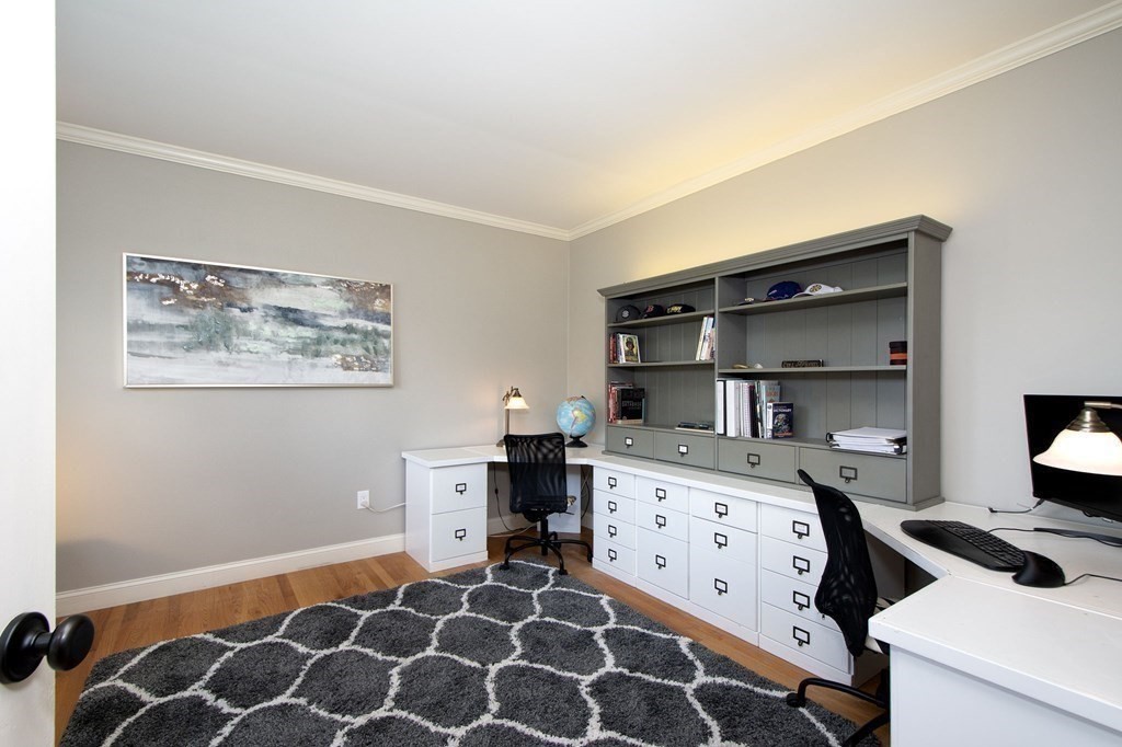 124 Hillcrest Road Marshfield, MA 02050 - Photo 15 of 41 a room with a baby crib and a dresser