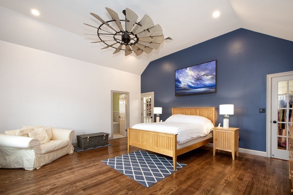 124 Hillcrest Road Marshfield, MA 02050 - Photo 17 of 41 a bedroom with a bed and a chandelier