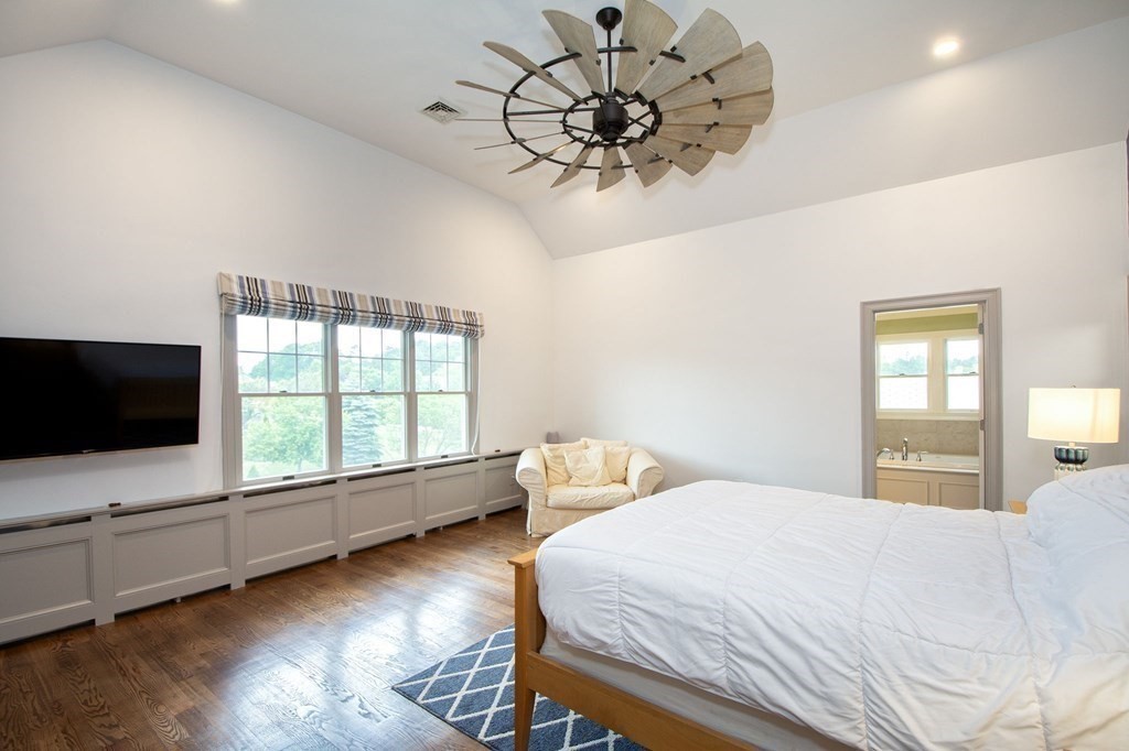 124 Hillcrest Road Marshfield, MA 02050 - Photo 18 of 41 a bedroom with a bed and a flat screen tv