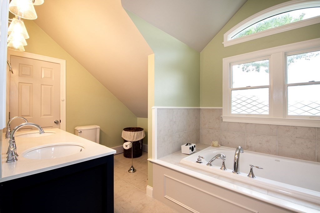 124 Hillcrest Road Marshfield, MA 02050 - Photo 19 of 41 a bathroom with a tub sink and mirror