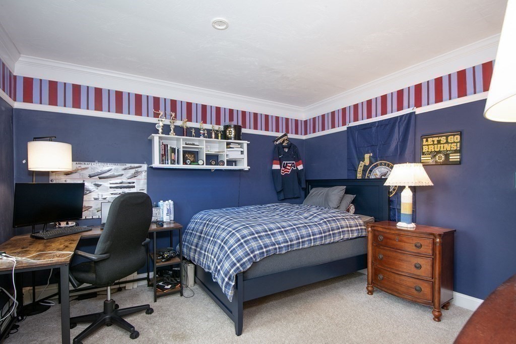 124 Hillcrest Road Marshfield, MA 02050 - Photo 24 of 41 a bedroom with a bed and a bookshelf