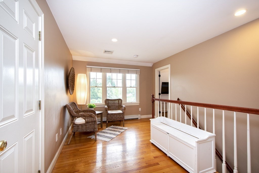 124 Hillcrest Road Marshfield, MA 02050 - Photo 26 of 41 a living room with furniture and wooden floor