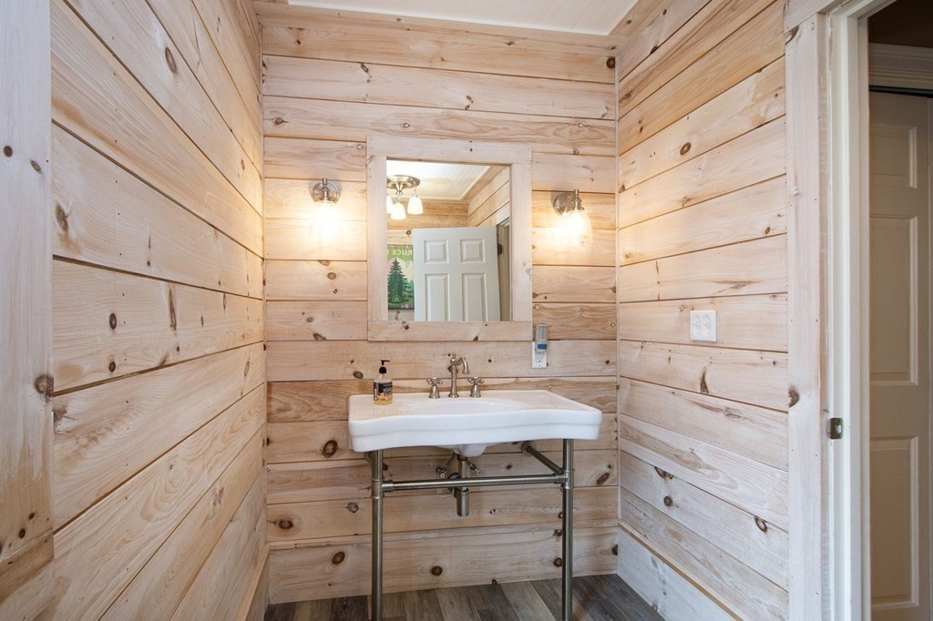 124 Hillcrest Road Marshfield, MA 02050 - Photo 28 of 41 a bathroom with a sink and a mirror
