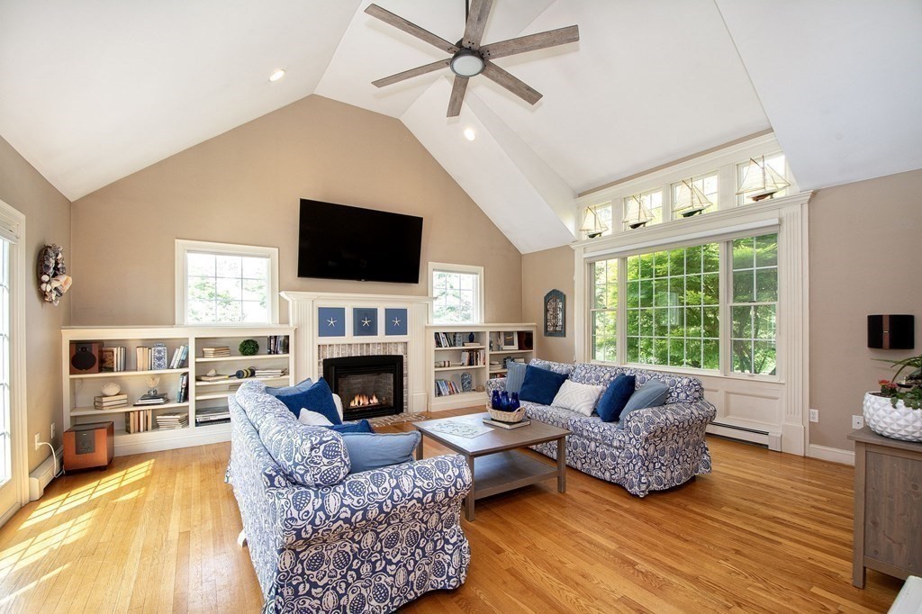 124 Hillcrest Road Marshfield, MA 02050 - Photo 4 of 41 a living room with furniture fireplace and a flat screen tv