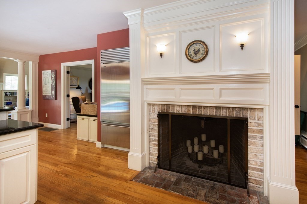 124 Hillcrest Road Marshfield, MA 02050 - Photo 9 of 41 a living room with furniture and a fireplace