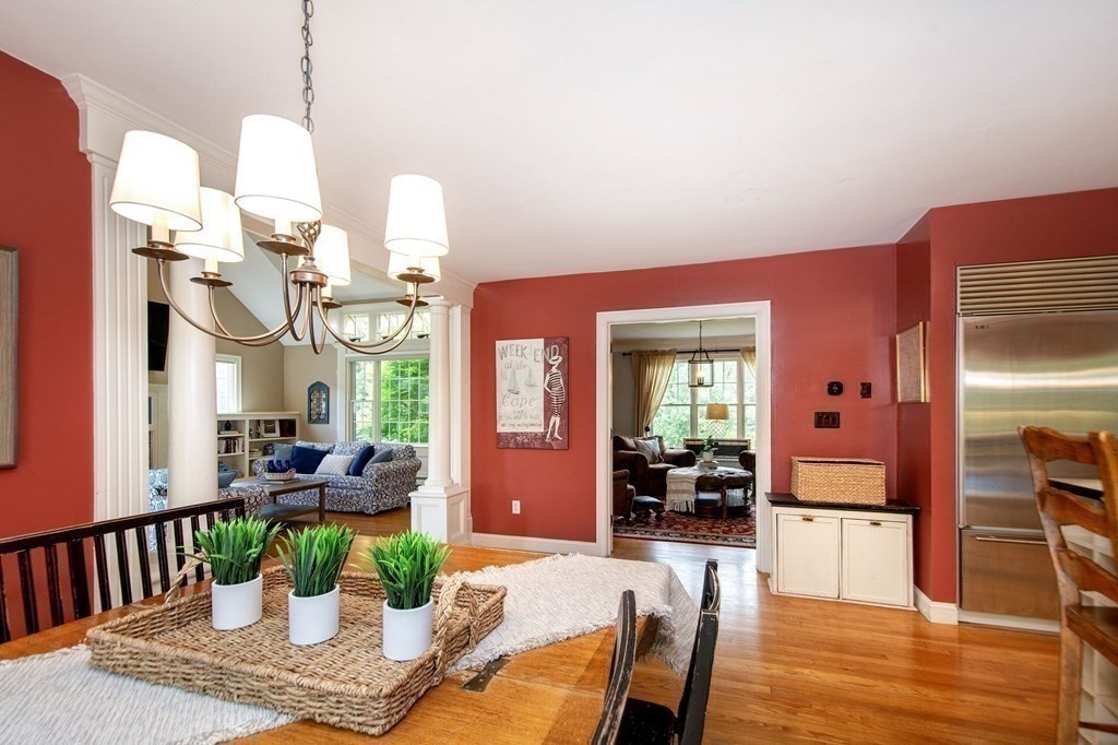 124 Hillcrest Road Marshfield, MA 02050 - Photo 10 of 41 a dining room with furniture a chandelier and wooden floor