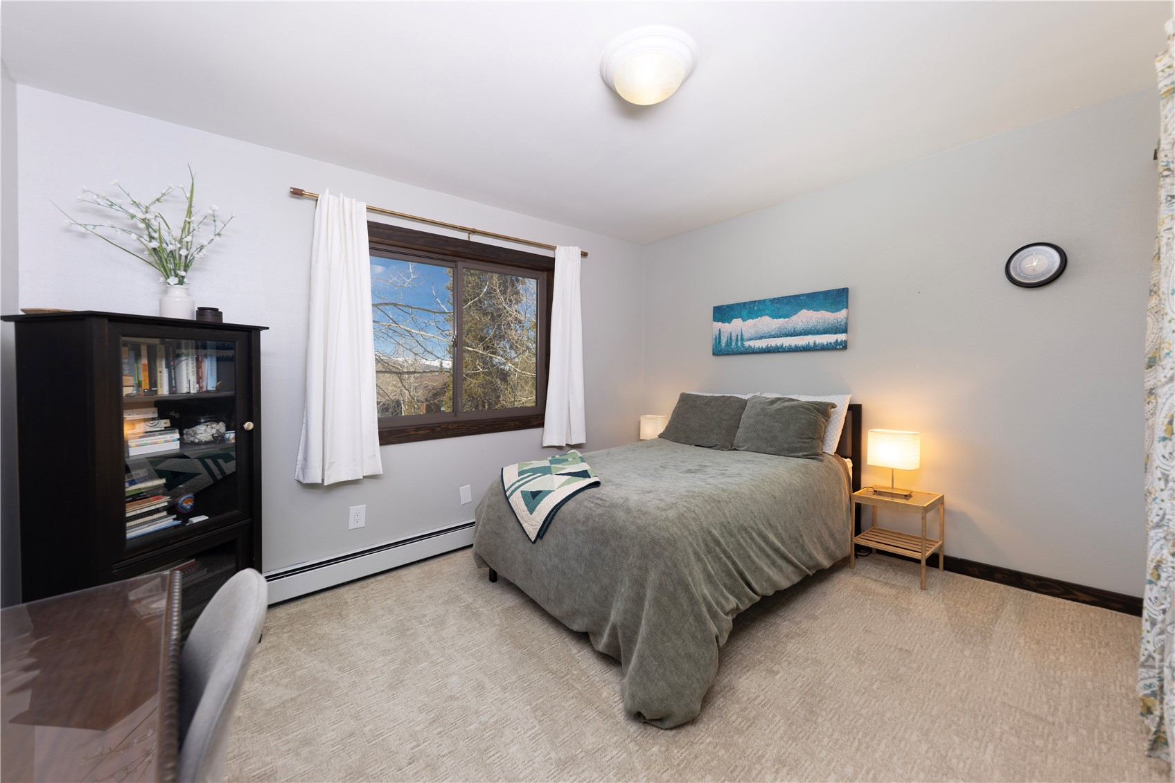 357 Vail Circle Dillon, CO 80435 - Photo 15 of 30 a bedroom with a bed and a window