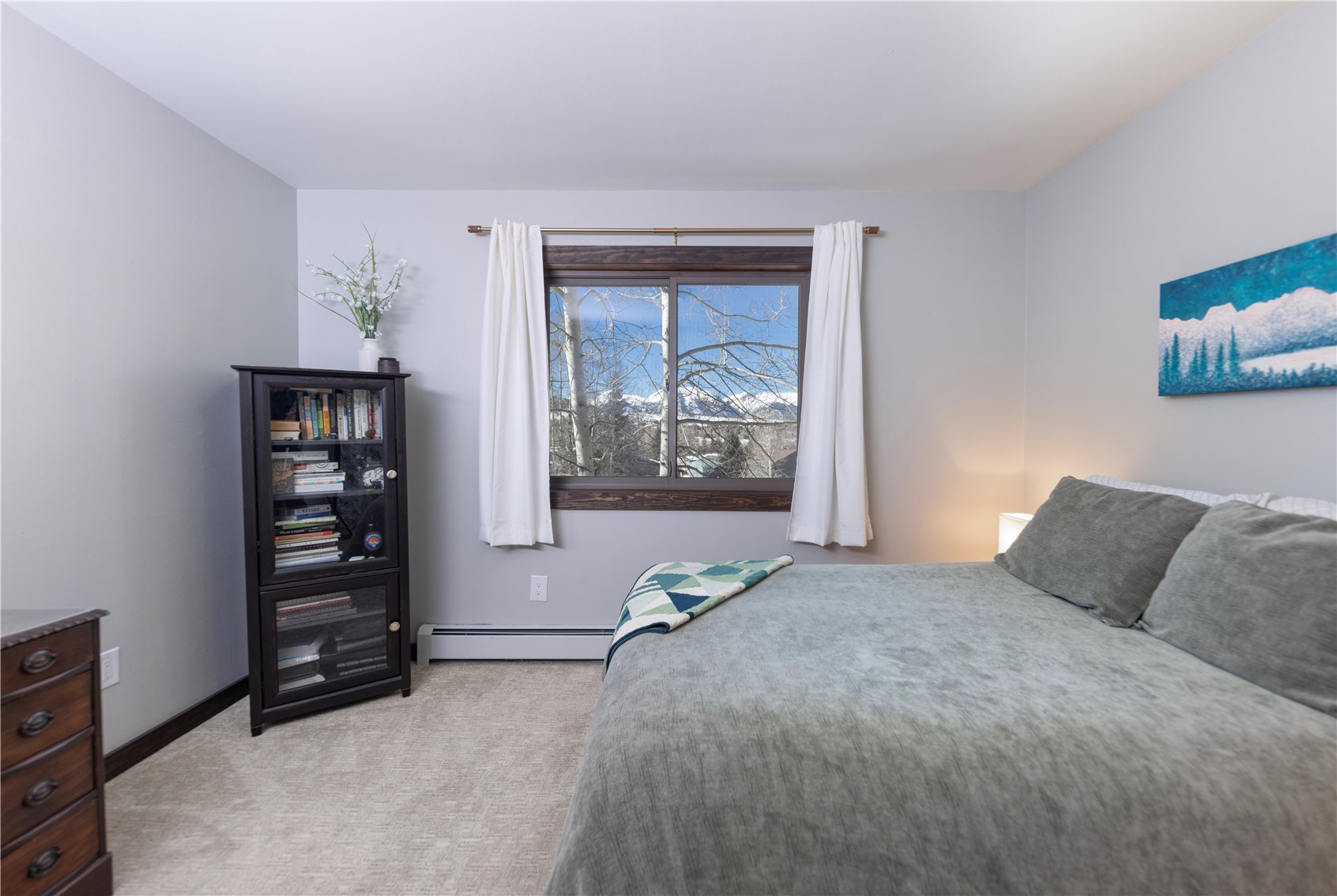 357 Vail Circle Dillon, CO 80435 - Photo 16 of 30 a bedroom with a bed and a window