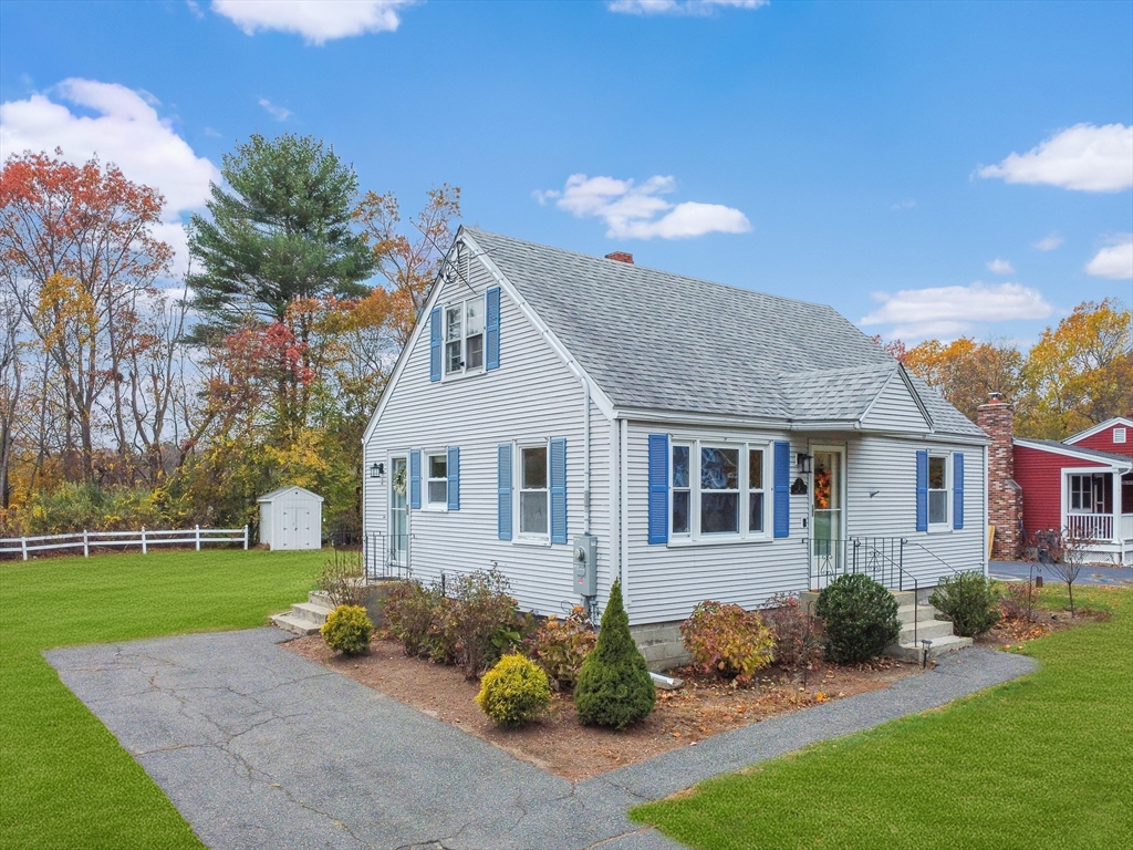 2 Campus Road Methuen, MA 01844 - Photo 2 of 19 a front view of a house with a yard and garage