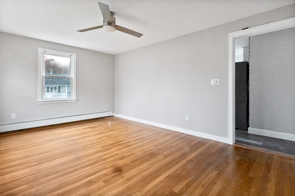 2 Campus Road Methuen, MA 01844 - Photo 4 of 19 an empty room with wooden floor and windows