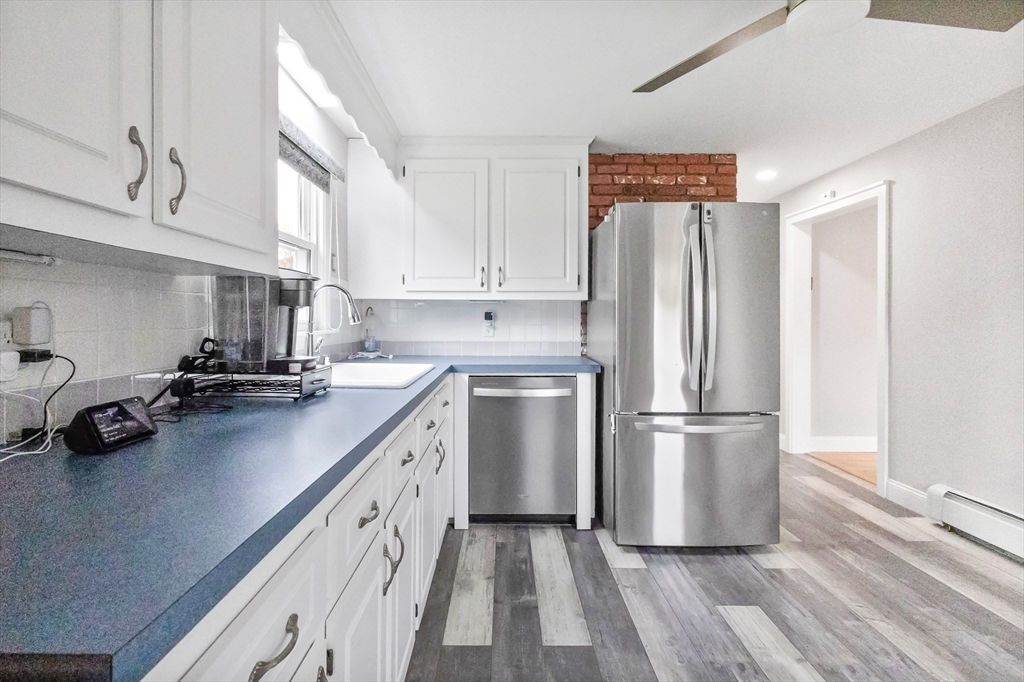 2 Campus Road Methuen, MA 01844 - Photo 7 of 19 a kitchen with a refrigerator a sink and white cabinets