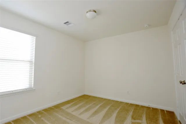 a view of a room with a window