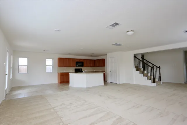 a view of a kitchen with furniture and window