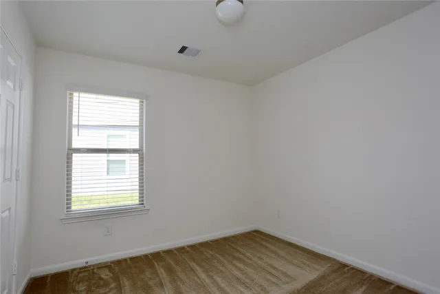 a view of a room that has a window in it