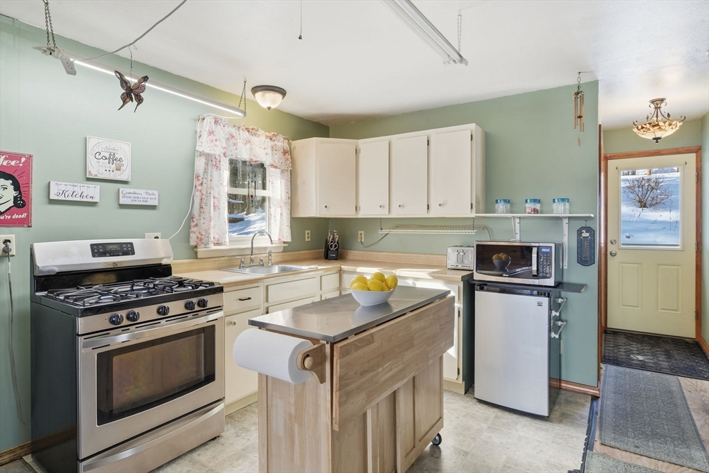 200 Fox Den Road Tolland, MA 01034 - Photo 13 of 37 a kitchen with a stove and a sink
