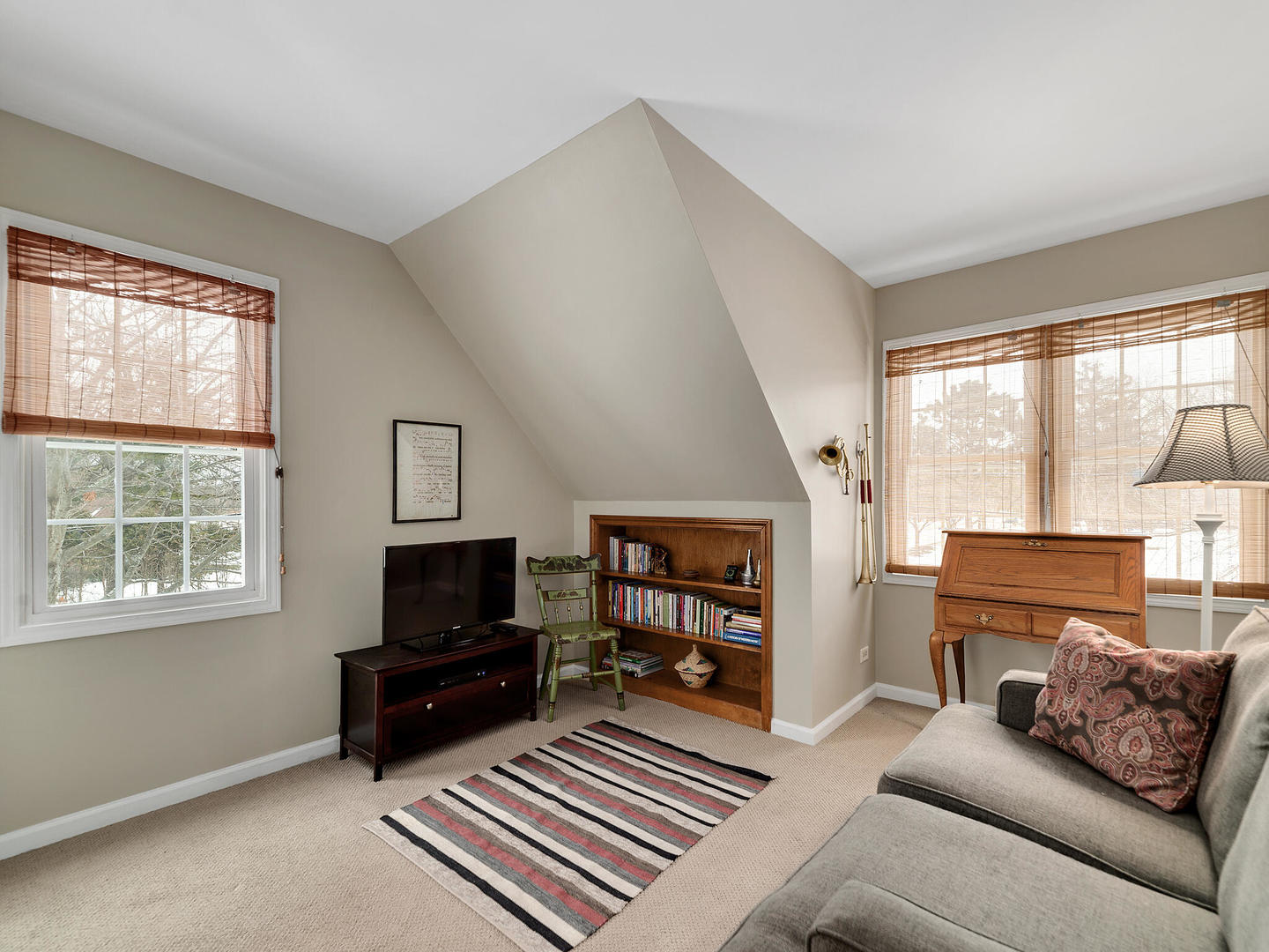 27W626 Garys Mill Road Winfield, IL 60190 - Photo 16 of 23 a living room with furniture a flat screen tv and a window